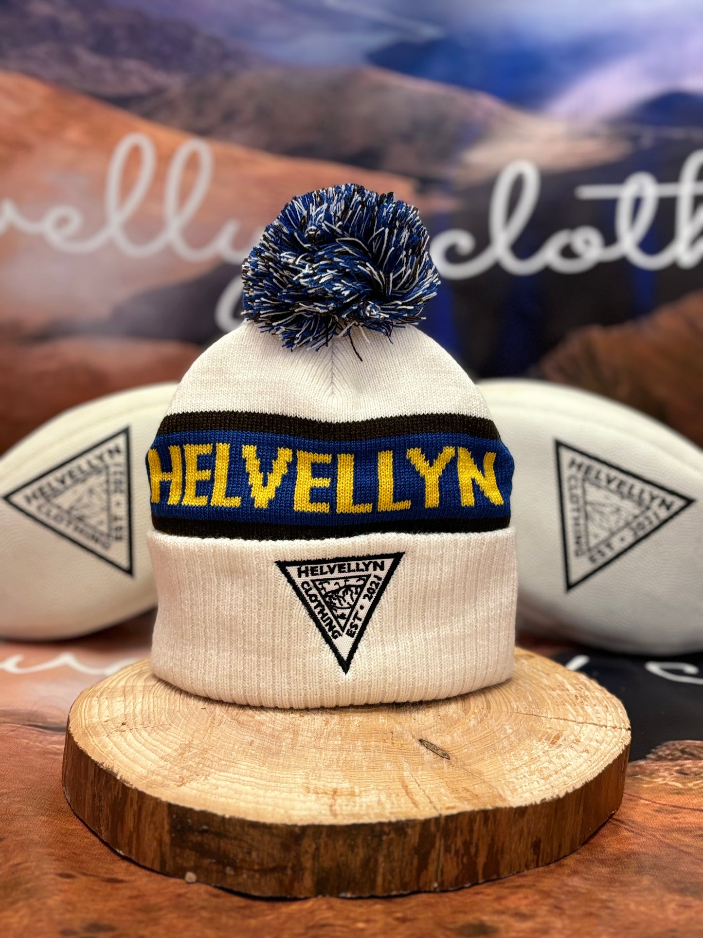 Helvellyn bobble hat, white with chocolate blue and gold colours