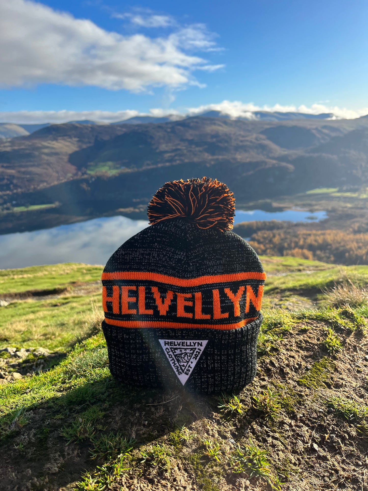 Grey and orange bobble hat